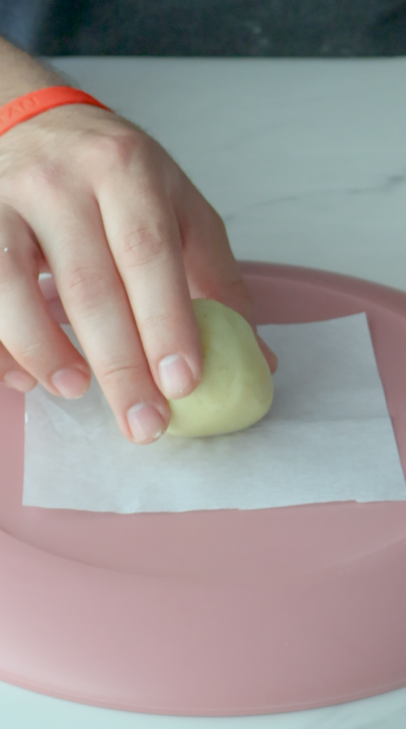 3. Form dough into round balls and flatter into perfect circles.